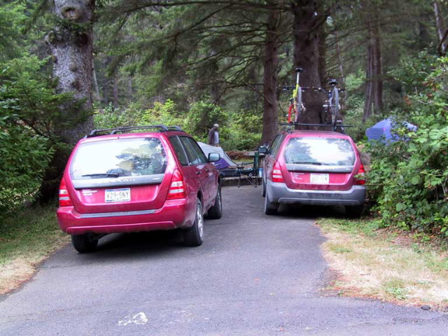 The matching red Subaru Foresters.
