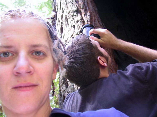 Self-portrait, with man taking photo. Avenue of the Giants.