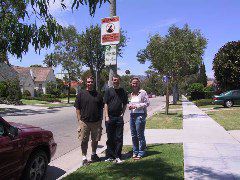 Rob, Jeff, and Jenn under the Beverly Hills Neighborhood Watch Sign